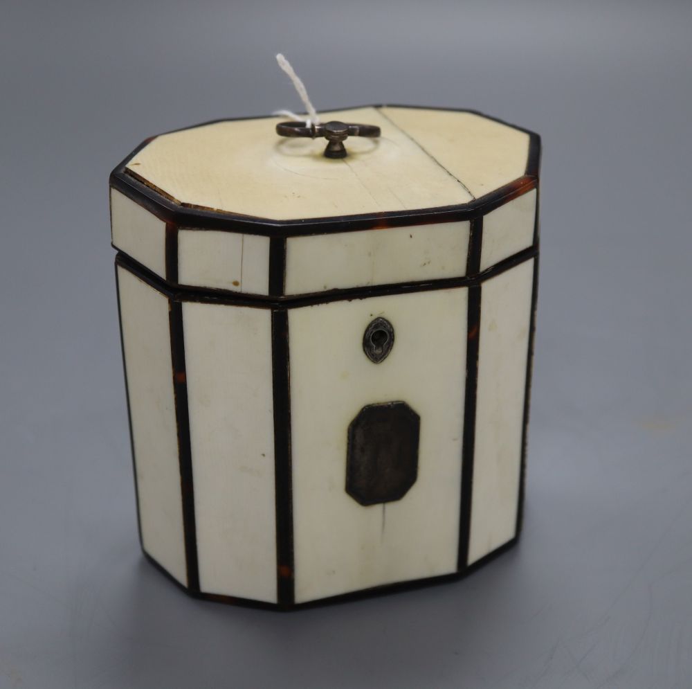 A George III octagonal ivory and tortoiseshell veneered tea caddy, height 10cm